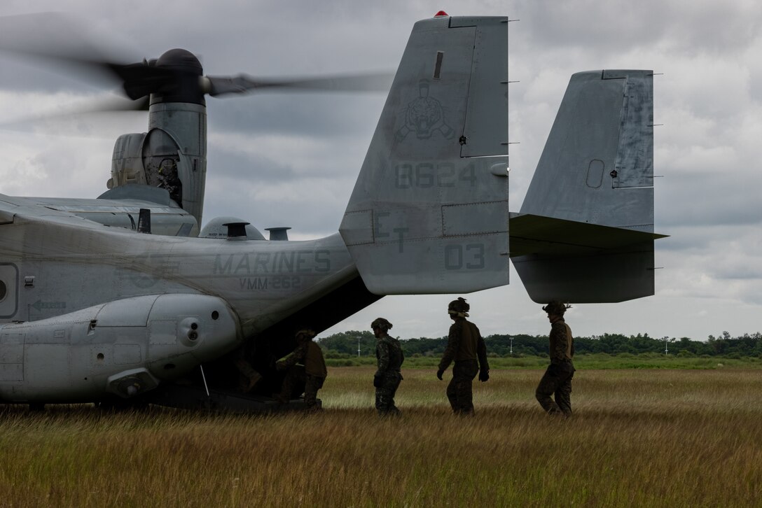 U.S. Marines with 3rd Marine Littoral Regiment, 3rd Marine Division and Philippine Marines board an MV-22 Osprey for fast rope training during Marine Aviation Support Activity (MASA) 23, Basa Air Base, Philippines, July 12, 2023. MASA is a bilateral exercise between the Armed Forces of the Philippines and the U.S. Marine Corps, aimed at enhancing interoperability and coordination focused on aviation-related capabilities. During MASA 23, Filipino and U.S. Marines conduct different training evolutions including live-fire, air assaults, and subject matter expert exchanges across aviation, ground, and logistics capabilities. (U.S. Marine Corps photo by Lance Cpl. Jesse Davis)