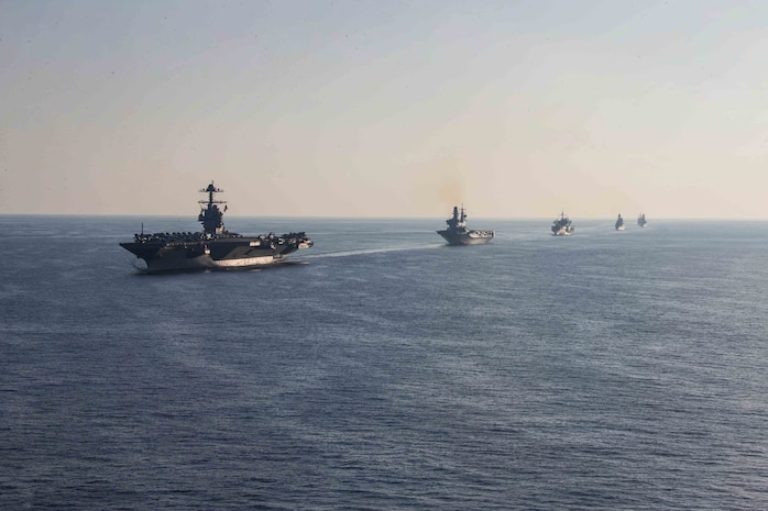 The world's largest aircraft carrier USS Gerald R. Ford (CVN 78), Italian Navy aircraft carrier ITS Cavour (C 550), the Blue Ridge-class command ship USS Mount Whitney (LCC 20), Italian Navy destroyer ITS Ciao Duilio (D 554), Italian Navy frigate ITS Virginio Fasan (F 591), and Ticonderoga-class guided-missile cruiser USS Normandy (CG 60) steam in formation in the Ionian Sea, Oct. 4, 2023 Gerald R. Ford is the U.S. Navy's newest and most advanced aircraft carrier, representing a generational leap in the U.S. Navy's capacity to project power on a global scale. The Gerald R. Ford Carrier Strike Group is on a scheduled deployment in the U.S. Naval Forces Europe area of operations, employed by U.S. Sixth Fleet to defend U.S., allied, and partner interests. (U.S. Navy photo by Mass Communication Specialist 2nd Class Jacob Mattingly)