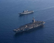 The world's largest aircraft carrier USS Gerald R. Ford (CVN 78) and Italian Navy aircraft carrier ITS Cavour (C 550), steam in formation in the Ionian Sea, Oct. 4, 2023 Gerald R. Ford is the U.S. Navy's newest and most advanced aircraft carrier, representing a generational leap in the U.S. Navy's capacity to project power on a global scale. The Gerald R. Ford Carrier Strike Group is on a scheduled deployment in the U.S. Naval Forces Europe area of operations, employed by U.S. Sixth Fleet to defend U.S., allied, and partner interests. (U.S. Navy photo by Mass Communication Specialist 2nd Class Jacob Mattingly)