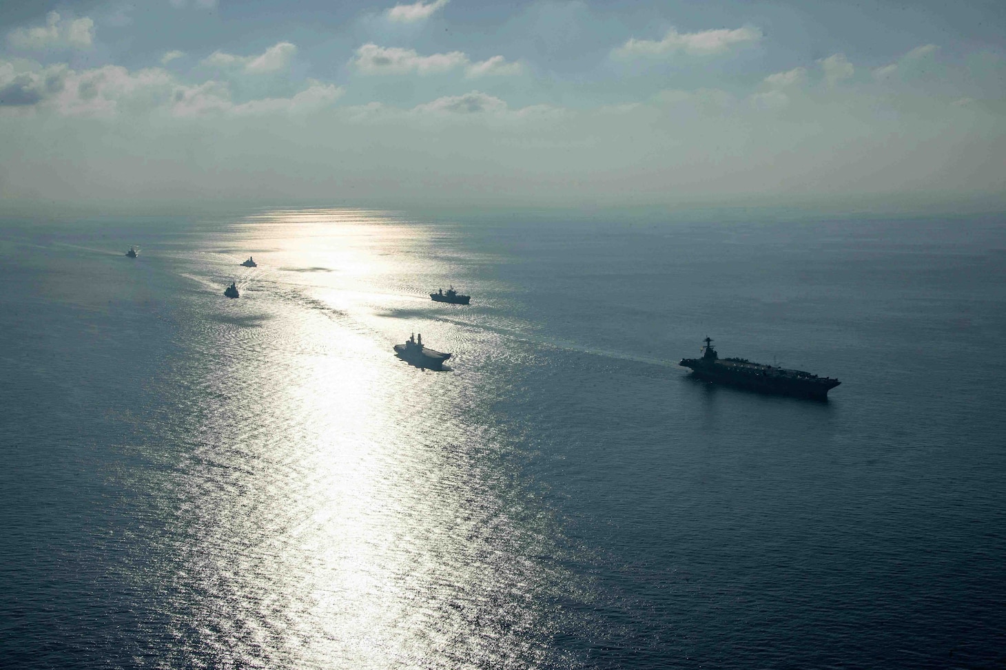 The world's largest aircraft carrier USS Gerald R. Ford (CVN 78), the Blue Ridge-class command ship USS Mount Whitney (LCC 20), Italian Navy aircraft carrier ITS Cavour (C 550), Italian Navy destroyer ITS Ciao Duilio (D 554), Italian Navy frigate ITS Virginio Fasan (F 591), and Ticonderoga-class guided-missile cruiser USS Normandy (CG 60) steam in formation in the Ionian Sea, Aug. 20, 2023 Gerald R. Ford is the U.S. Navy's newest and most advanced aircraft carrier, representing a generational leap in the U.S. Navy's capacity to project power on a global scale. The Gerald R. Ford Carrier Strike Group is on a scheduled deployment in the U.S. Naval Forces Europe area of operations, employed by U.S. Sixth Fleet to defend U.S., allied, and partner interests. (U.S. Navy photo by Mass Communication Specialist 3rd Class Maxwell Orlosky)