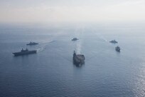 The world's largest aircraft carrier USS Gerald R. Ford (CVN 78), Italian Navy aircraft carrier ITS Cavour (C 550), the Blue Ridge-class command ship USS Mount Whitney (LCC 20), Italian Navy destroyer ITS Ciao Duilio (D 554), Italian Navy frigate ITS Virginio Fasan (F 591), and Ticonderoga-class guided-missile cruiser USS Normandy (CG 60) steam in formation in the Ionian Sea, Oct. 4, 2023 Gerald R. Ford is the U.S. Navy's newest and most advanced aircraft carrier, representing a generational leap in the U.S. Navy's capacity to project power on a global scale. The Gerald R. Ford Carrier Strike Group is on a scheduled deployment in the U.S. Naval Forces Europe area of operations, employed by U.S. Sixth Fleet to defend U.S., allied, and partner interests. (U.S. Navy photo by Mass Communication Specialist 2nd Class Jacob Mattingly)