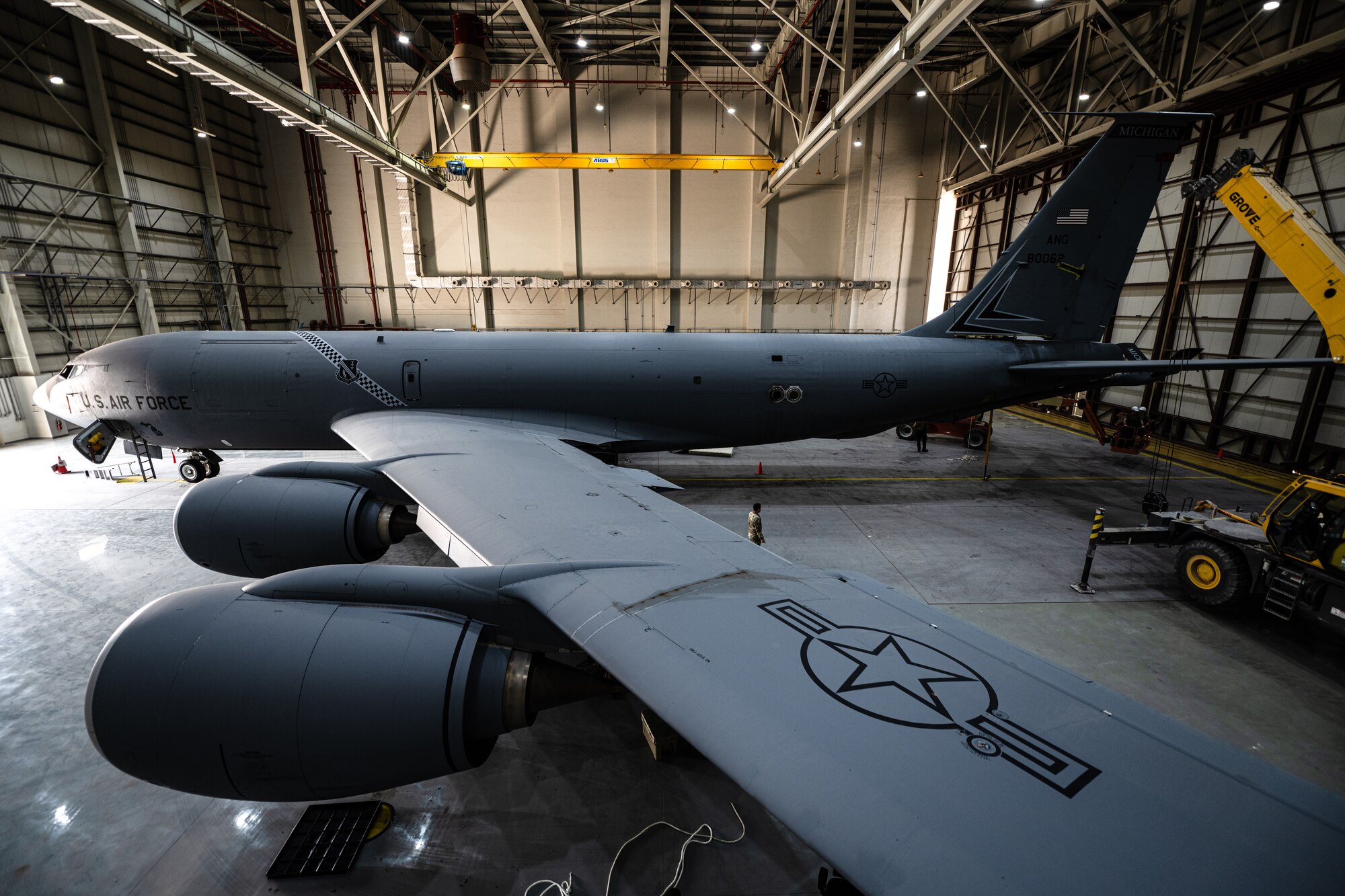 Airmen removing an aircraft tail fin