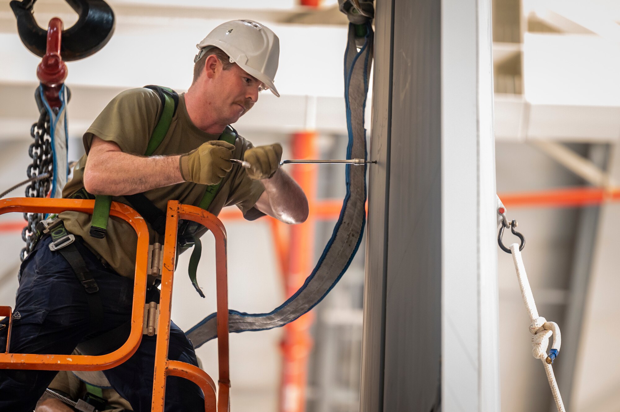 Airman performing maintenance on an aircraft