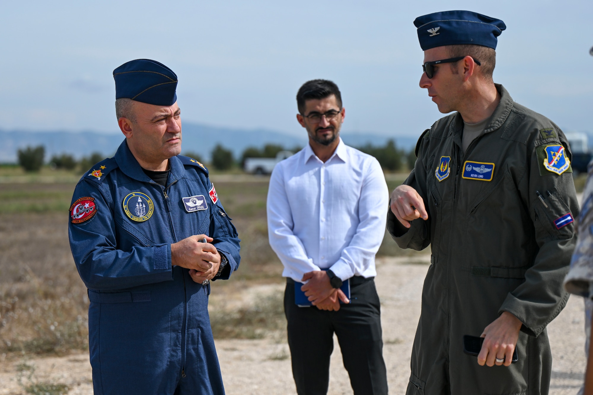 Turkish Air Force Brig. Gen. Kemel Güleç, commander of the 10th Tanker Base Command, left, and U.S. Air Force Col. Kevin Lord, 39th Air Base Wing commander, right, discuss crisis response procedures during an exercise at Incirlik Air Base, Türkiye, Oct. 3, 2023.