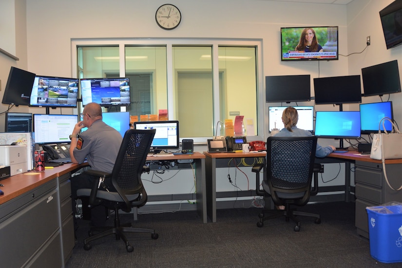 Police department employees work in the dispatch area of the new police station that opened recently at Fort Indiantown Gap. The station replaces two World War II-era buildings the police department had been using. (Pennsylvania National Guard photo by Brad Rhen)