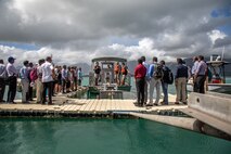 U.S. Navy Sailors with Waterfront Operations, Marine Corps Base Hawaii, brief the employment of a fast response contaminate skimmer to Indo-Pacific partners during an oil response capabilities demonstration, MCBH, Sept. 21, 2023. The visit and demonstration, coordinated by the U.S. State Department and U.S. Navy, provided concepts and capabilities to assist the partner countries of Sri Lanka and Maldives develop marine environmental conservation programs. (U.S. Marine Corps photo by Lance Cpl. Hunter Jones)