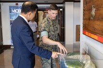 U.S. Marine Corps Col. Jeremy Beaven, right, commanding officer, Marine Corps Base Hawaii, showcases a model of the Ulupa'u Crater to Seo Young Lee, Consul General of the Republic of Korea in Honolulu, during a visit, MCBH, Sep. 26, 2023. The purpose of the visit was to communicate ongoing installation and tenant command efforts and to strengthen the relationship between the United States and the Republic of Korea. (U.S. Marine Corps photo by Cpl. Chandler Stacy)