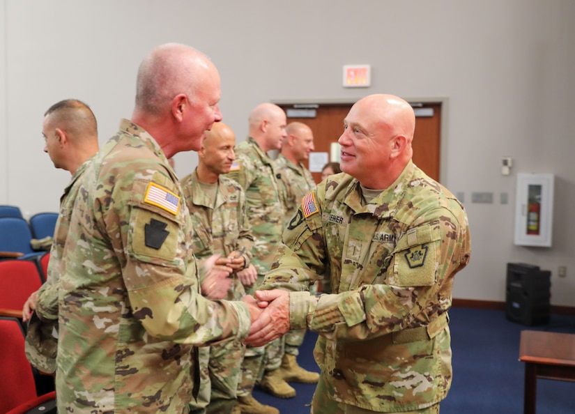 Maj. Gen. Mark Schindler, Pennsylvania's adjutant general, congratulates Chief Warrant Officer 5 Darren Dreher, the Pennsylvania Army National Guard’s new command chief warrant officer, who takes over for Chief Warrant Officer 5 James Fontini in a change of responsibility ceremony Oct. 5, 2023, at Fort Indiantown Gap. (U.S. Army National Guard photo by Sgt. 1st Class Zane Craig)