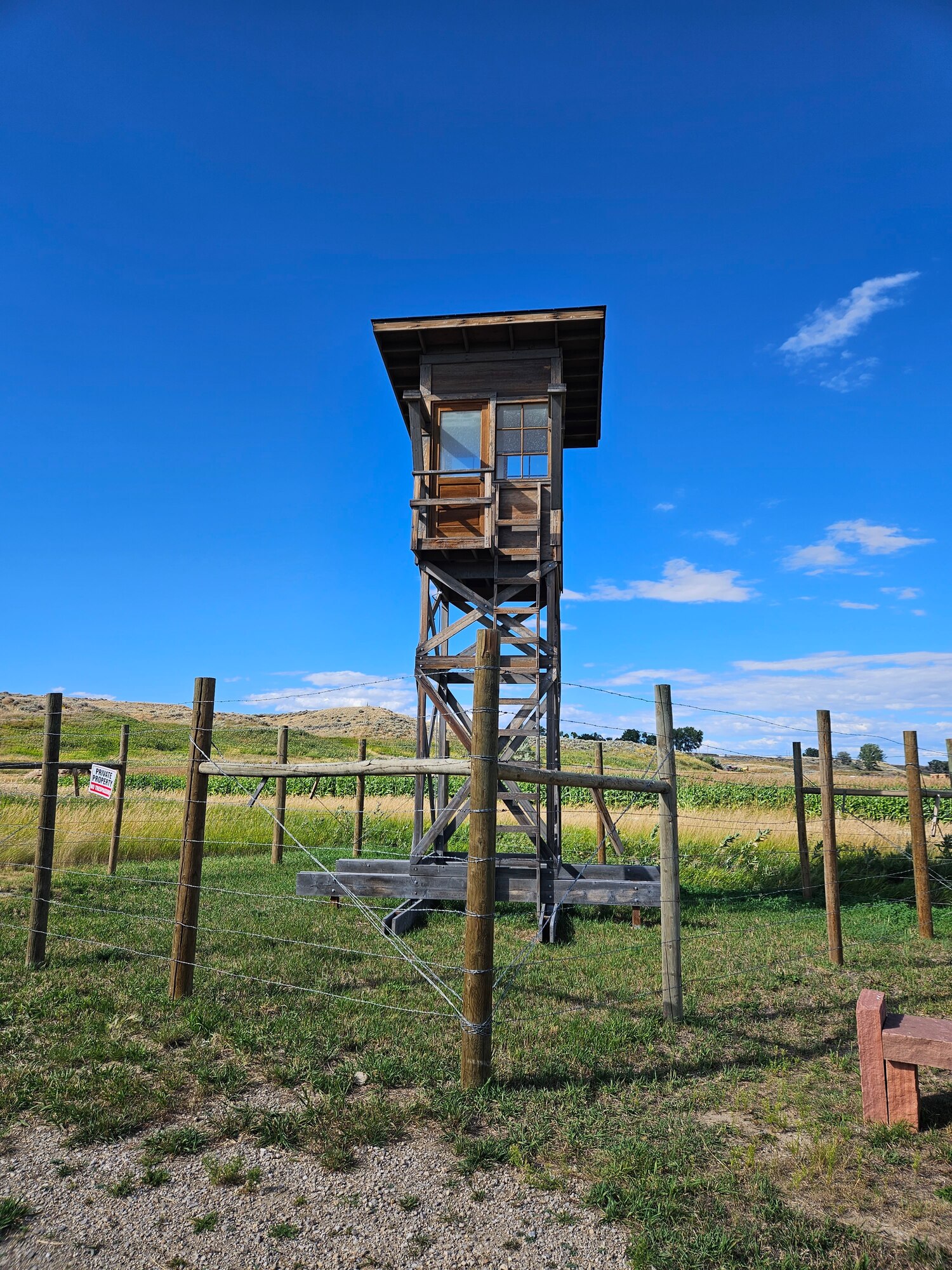 guard tower looming high in the photo over the Heart Mountain internment camp