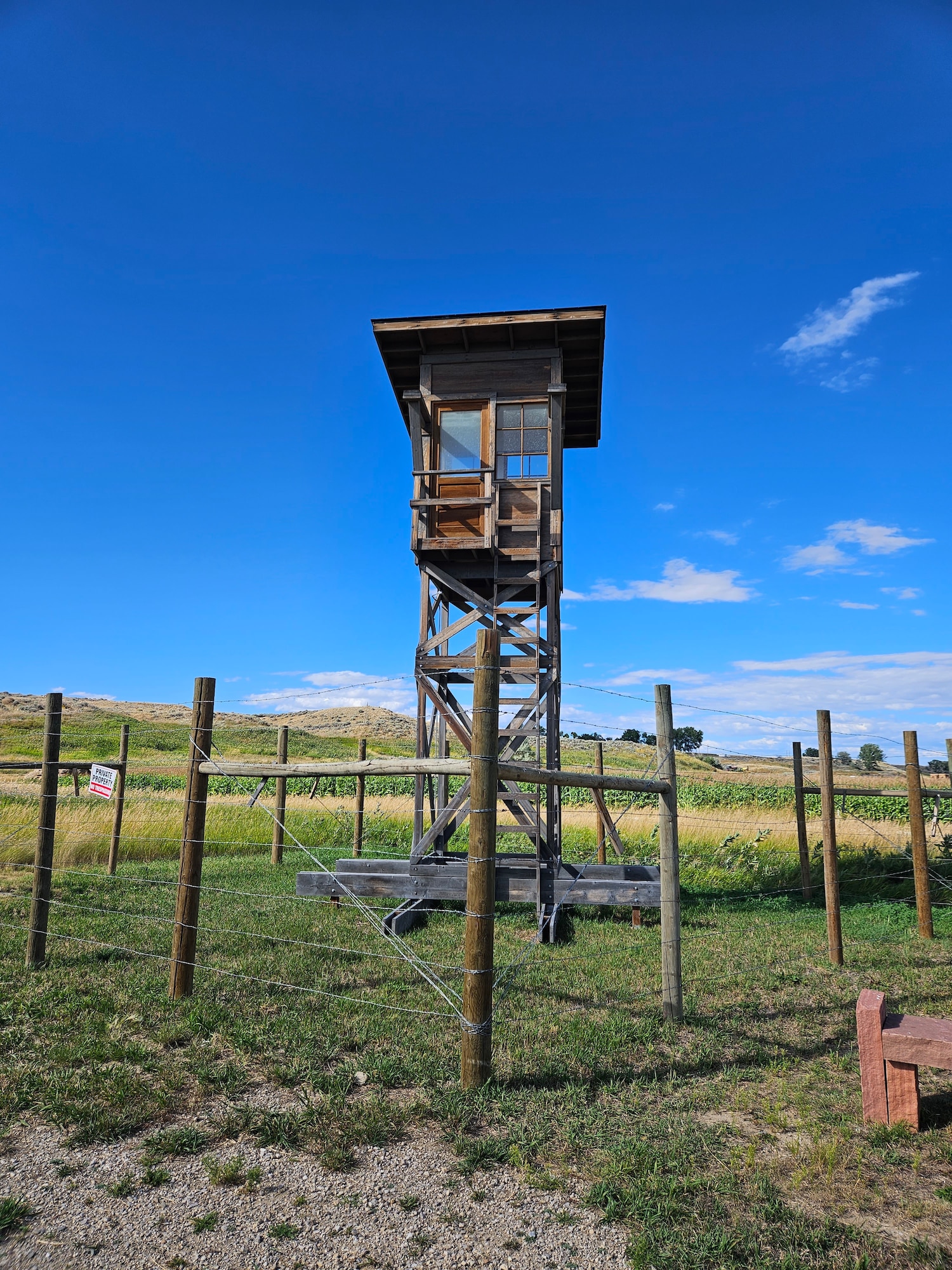 guard tower looming high in the photo over the Heart Mountain internment camp