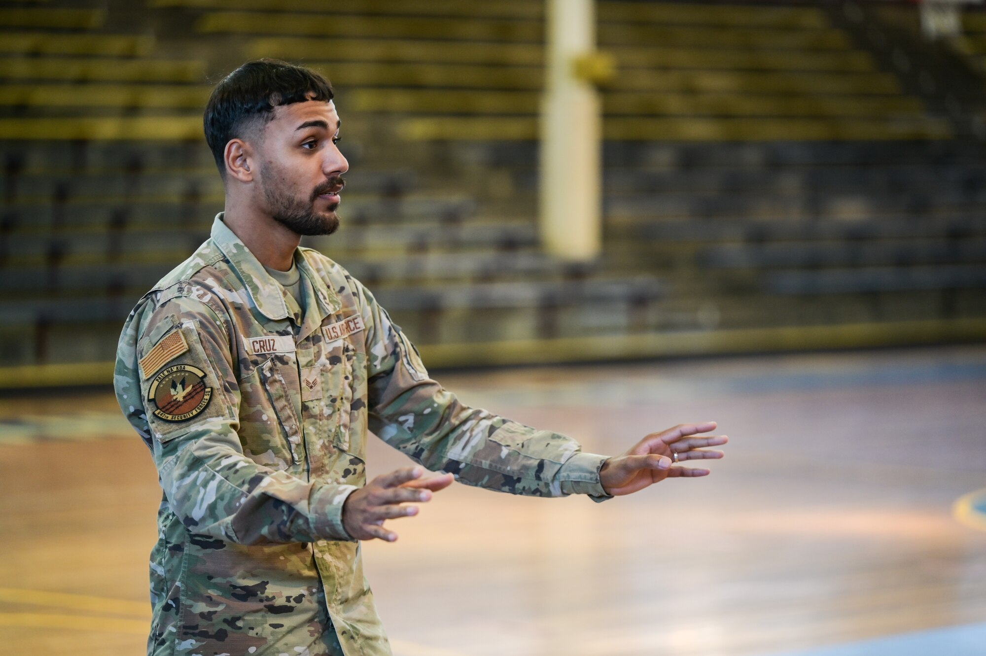 Senior Airman Frist Cruz, 647th Security Forces Squadron patrolman, shares his life story during a mental health brief at Joint Base Pearl Harbor-Hickam, Hawaii, Oct. 4, 2023. The event was held to give Airmen the opportunity to be exposed to scenarios that they or someone they know could face in the future, enhancing their mental wellness. (U.S. Air Force photo by Staff Sgt. Alan Ricker)