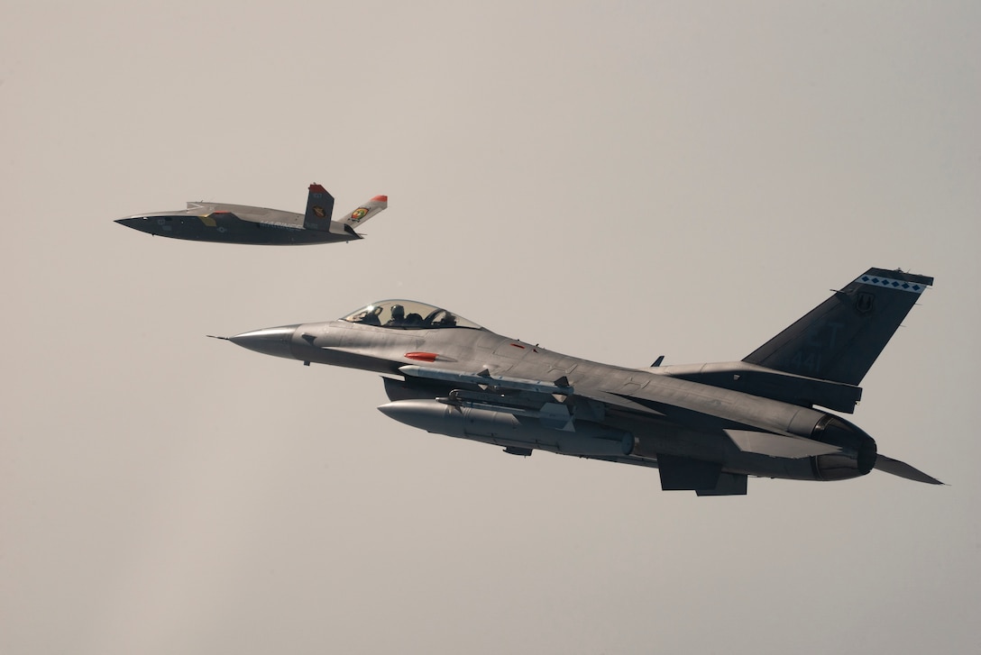 A U.S. Marine Corps XQ-58A Valkyrie, highly autonomous, low-cost tactical unmanned air vehicle, conducts its first test flight with a U.S. Air Force F-16 Fighting Falcon aircraft assigned to 96th Test Wing at Eglin Air Force Base, Fla., Oct. 3, 2023. The XQ-58A Valkyrie test flight and the data collected inform future requirements for the Marine Corps in a rapidly evolving security environment, while successfully fueling joint innovation and experimentation opportunities.