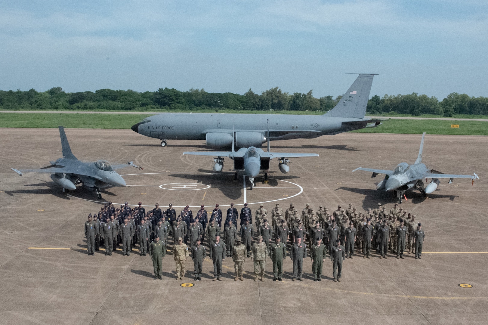 Service members from the Washington and Oregon Air National Guard stand alongside the Royal Thai Air Force members on Korat Air Base, Royal Kingdom of Thailand during the closing ceremony for the Enduring Partners engagement 2023, Sept. 21, 2023. Two weeks were spent collaborating and building a stronger relationship with the Royal Thai Air Force. (U.S. Air National Guard photo by Senior Airman Yuki Klein)