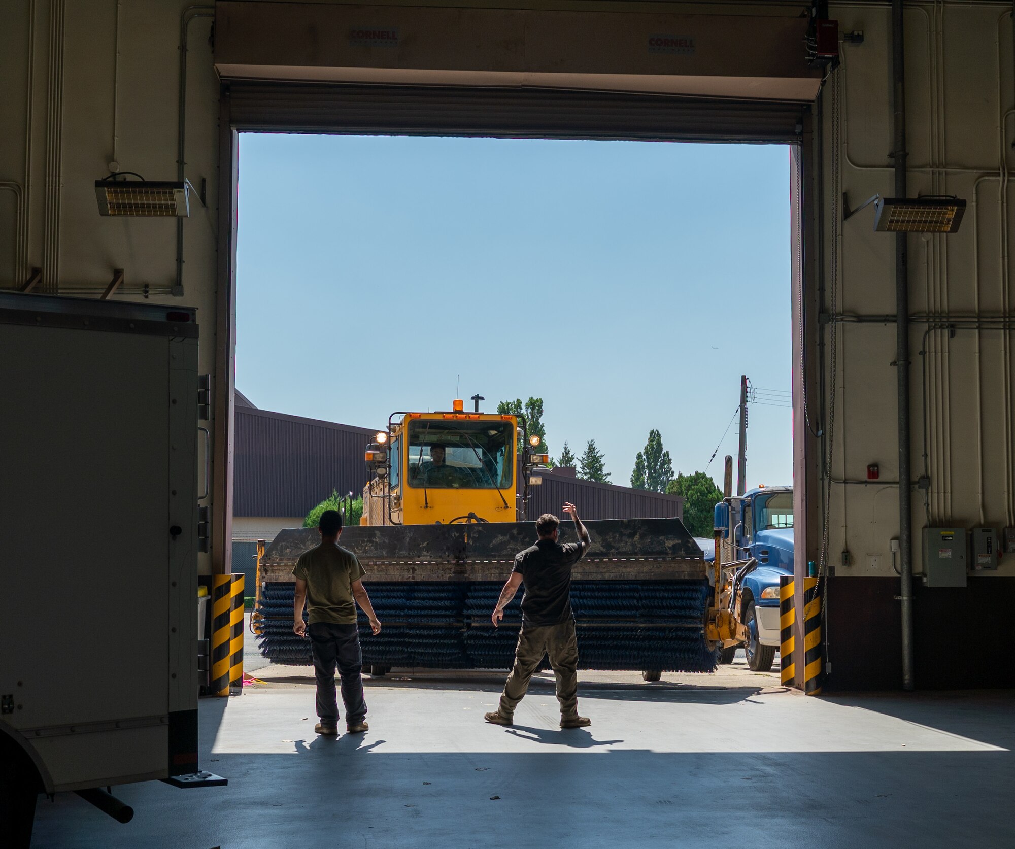 U.S. Air Force members from the 51st Logistics Readiness Squadron vehicle maintenance section, usher in a snow broom at Osan Air Base, Republic of Korea, Sept. 8, 2023. Winter service vehicles undergo preventative maintenance during the summer rebuild phase to ensure mission readiness in snowy weather. Assets, like heavy equipment, are included in the vehicle validation process to determine asset retainability for unit mission readiness. (U.S. Air Force photo by Staff Sgt. Kelsea Caballero)