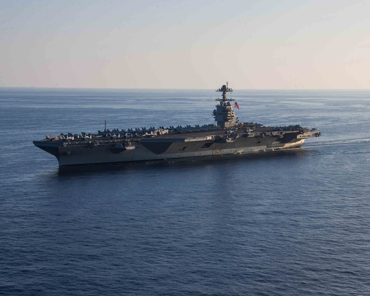 A ships transits a body of water.