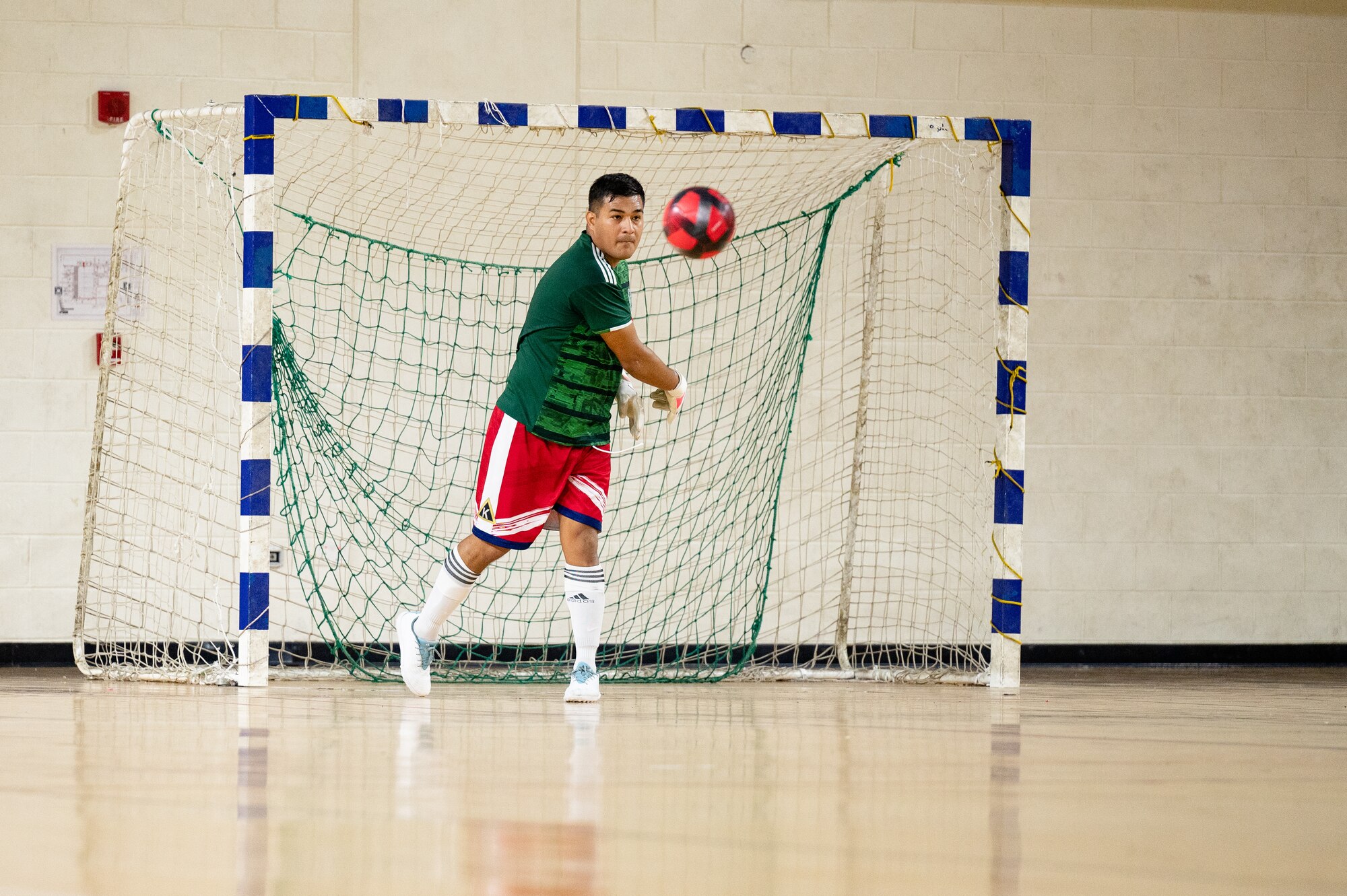 Goalie blocking a soccer ball
