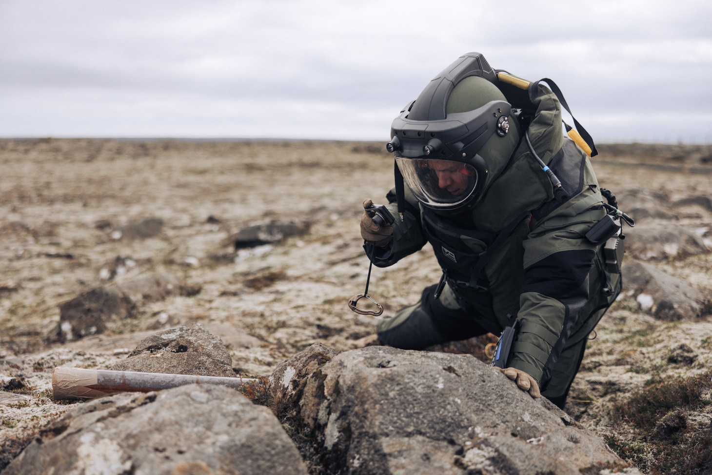 U.S. Marine Corps Staff Sgt. Mark Frick, a native of Baltimore, Maryland and explosive ordnance disposal team leader with the 26th Marine Expeditionary Unit (Special Operations Capable) (26MEU(SOC)), photographs a neutralized simulated improvised explosive device during Exercise Northern Challenge 2023, Keflavik Airport, Iceland, Sept. 22, 2023. Northern Challenge 23 is an Icelandic Coast Guard-led bomb disposal exercise, hosted to train teams from over a dozen nations with response to incidents involving simulated improvised and military explosive devices. The San Antonio-class amphibious transport dock ship USS Mesa Verde (LPD 19), assigned to the Bataan Amphibious Ready Group and embarked 26MEU(SOC), under the command and control of Task Force 61/2, is on a scheduled deployment in the U.S. Naval Forces Europe area of operations, employed by U.S. Sixth Fleet to defend U.S., Allied, and partner interests. (U.S. Marine Corps photo by Cpl. Kyle Jia)