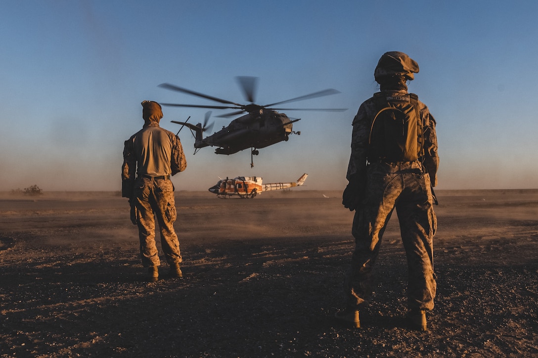 U.S. Marines with Marine Heavy Helicopter Squadron 465, Marine Aircraft Group 16, 3rd Marine Aircraft wing, drop-off a helicopter with a CH-53E Super Stallion while conducting helicopter support team operations during Weapons and Tactics Instructor course 1-24 in Yuma, Arizona, Oct. 3, 2023. WTI 1-24 is an advanced seven-week course, which provides standardized tactical training and incorporates Marine Corps planning and implementation of air and ground tactics through a series of escalating evolutions, to support Marine aviation training and readiness.
