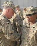 116th BCT Soldiers pin combat patch during ceremony in Afghanistan