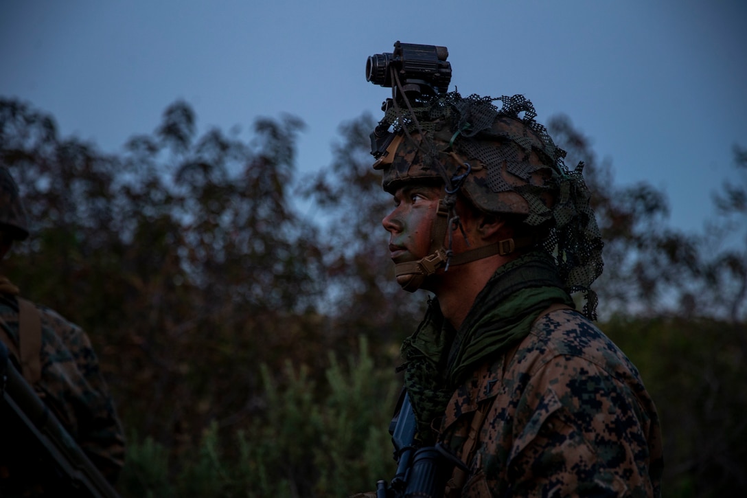 A U.S. Marine with Alpha Company, Infantry Training Battalion, School of Infantry - West, kneels during a night patrol as part of the tenth week of the Infantry Marine Course on Marine Corps Base Camp Pendleton, California, April 1, 2021. IMC is a 14-week pilot course designed to create better trained and more lethal entry-level infantry Marines prepared for near-peer conflicts. The course uses a redesigned learning model for students intended to develop their capabilities for independent and adaptive thought and action. The program of instruction for IMC has been in development for a year and follows guidance from the 2019 Commandant's Planning Guidance and Force Design 2030. (U.S. Marine Corps photo by Lance Cpl. Kerstin Roberts)