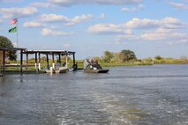 The project stretches along both sides of the Trinity River and both north and south of Interstate Highway 10 about halfway between Houston and Beaumont, Texas. Much of the Project is accessible by boat from boat launch facilities at Hugo Point Park (Gou Hole Road off FM 565 south from I-10), Trinity River Island Recreation Area (the Project Office area just south of I-10 on Lock and Dam Road from exits 806 and 807), under the high bridge over the Trinity River (accessed from the Trinity River Boat Ramp Turnaround off I-10), and a hand-launch canoe/kayak area at Cedar Hill Park (from I-10 take FM 563 north to Lake Charlotte Road west to the park).