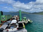 Response crews aboard the Bonnie G cargo vessel during response efforts Oct. 6, 2023, after the vessel ran aground Wednesday, half a nautical mile south of the local airport in St. Thomas, U.S. Virgin Islands.  As response efforts continue, the Coast Guard has established a Safety Zone extending a quarter of a mile around the Bonnie G. Commercial and recreational vessel traffic should remain clear of this area for their safety and the safety of response crews working the site. (Courtesy photo)