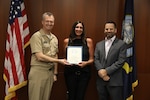 Naval Surface Warfare Center, Philadelphia Division (NSWCPD) Commanding Officer Capt. Joseph Darcy (left) and Department Head for NSWCPD’s Cybersecure HM&E Control Systems & Networks Department Seth Burmaster (right) present Electrical Engineer Dana Golden-Squilla (center) with a Career Service Award for 25 years of service to the U.S. Navy during NSWCPD’s Fiscal Year (FY) 2023 Third Quarter Awards Ceremony on Aug. 29, 2023. (U.S. Navy photo by Phillip Scaringi/Released)