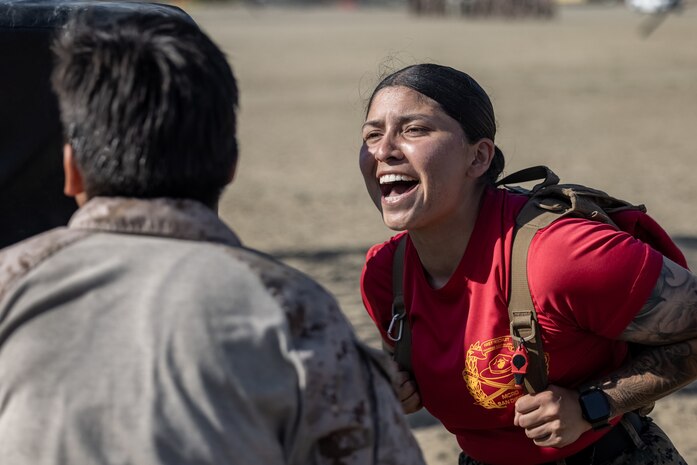U.S. Marine Corps drill instructor Sgt. Maribel Castaneda with Charlie Company, 1st Recruit Training Battalion, instructs a recruit during a confidence course event at Marine Corps Recruit Depot San Diego, Oct. 2, 2023. The confidence course challenges recruits physically, mentally, and spiritually through obstacles that require confidence in their strength, balance, and determination. (U.S. Marine Corps photo by Lance Cpl. Jacob B. Hutchinson)