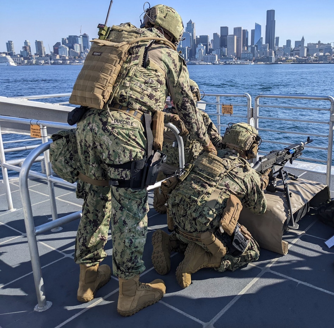 U.S. Coast Guard Port Security Unit (PSU) 313 servicemembers participate a training exercise in Elliot Bay, Seattle, Sept. 16, 2023. PSU 313 partnered with King County Metro Transit to conduct a joint training exercise that involved the MV Sally Fox, a 104-foot passenger-only ferry operated by King County Water Taxi. U.S. Coast Guard courtesy photo.