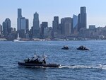 U.S. Coast Guard Port Security Unit (PSU) 313 servicemembers aboard 32-foot Transportable Port Security Boats conduct a training exercise in Elliot Bay, Seattle, Sept. 16, 2023. PSU 313 partnered with King County Metro Transit to conduct a joint training exercise that involved the MV Sally Fox, a 104-foot passenger-only ferry operated by King County Water Taxi. U.S. Coast Guard courtesy photo.