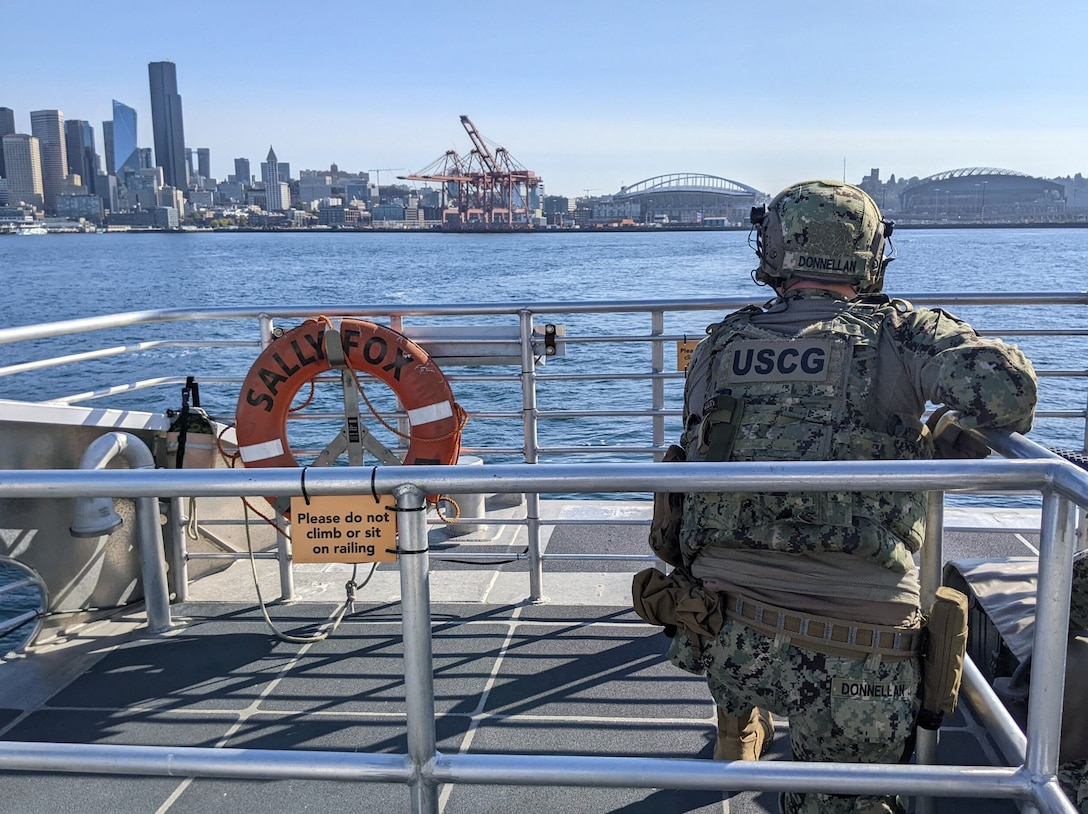 A U.S. Coast Guard Port Security Unit (PSU) 313 servicemember participates in a training exercise in Elliot Bay, Seattle, Sept. 16, 2023. PSU 313 partnered with King County Metro Transit to conduct a joint training exercise that involved the MV Sally Fox, a 104-foot passenger-only ferry operated by King County Water Taxi. U.S. Coast Guard courtesy photo.