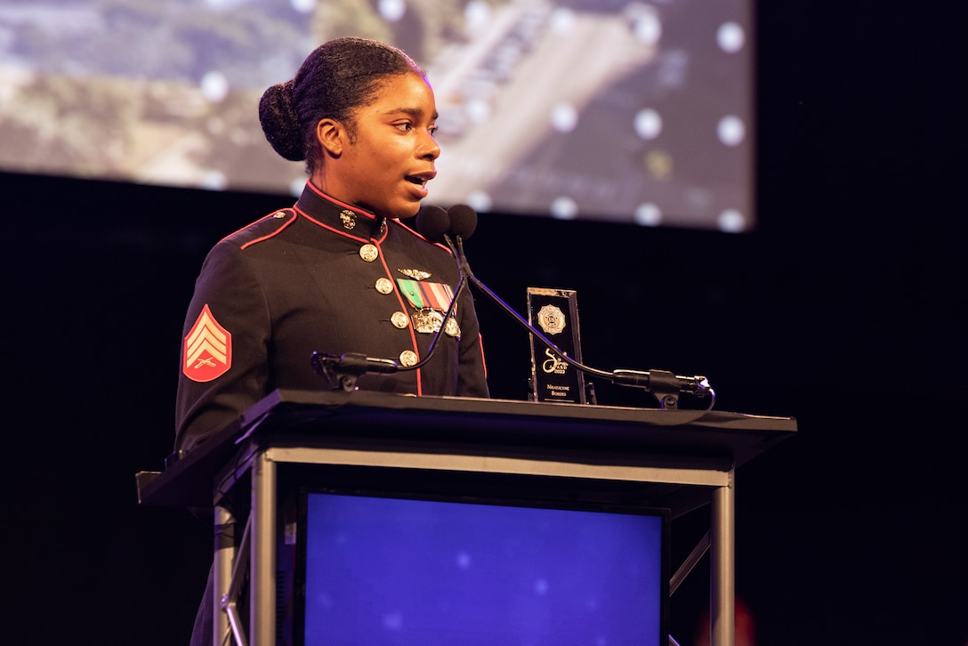 U.S. Marine Corps Sgt. Nhatalyne Bordes, a legal chief, office of the Staff Judge Advocate, with Headquarters and Headquarters Squadron, Marine Corps Air Station New River, gives a speech during the 104th American Legion National Convention in Charlotte, North Carolina, Aug. 29, 2023. Bordes received the 2023 American Legion Spirit Service Award for the U.S. Marine Corps. (U.S. Marine Corps photo by Cpl. Jennifer E. Douds)