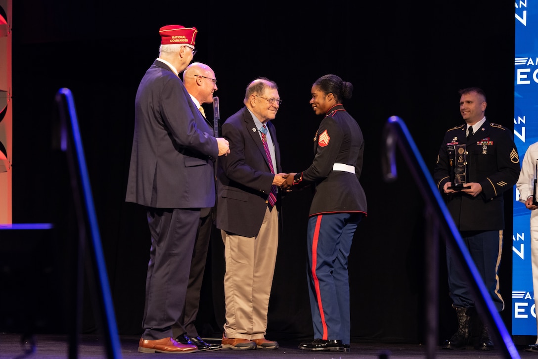 U.S. Marine Corps Sgt. Nhatalyne Bordes, a legal chief, office of the Staff Judge Advocate, with Headquarters and Headquarters Squadron, Marine Corps Air Station New River, receives an award during the 104th American Legion National Convention in Charlotte, North Carolina, Aug. 29, 2023. Bordes received the 2023 American Legion Spirit Service Award for the U.S. Marine Corps. (U.S. Marine Corps photo by Cpl. Jennifer E. Douds)