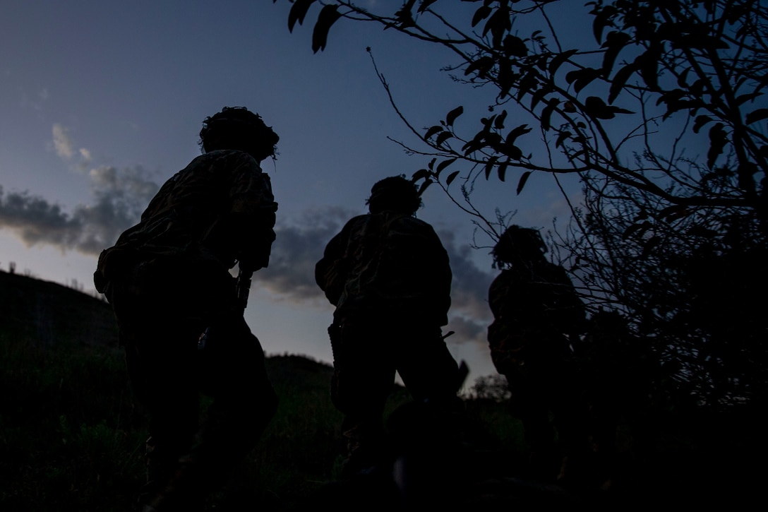 U.S. Marines with Alpha Company, Infantry Training Battalion, School of Infantry - West, hike up a hill during a night patrol as part of the tenth week of the Infantry Marine Course on Marine Corps Base Camp Pendleton, California, April 1, 2021. IMC is a 14-week pilot course designed to create better trained and more lethal entry-level infantry Marines prepared for near-peer conflicts. The course uses a redesigned learning model for students intended to develop their capabilities for independent and adaptive thought and action. The program of instruction for IMC has been in development for a year and follows guidance from the 2019 Commandant's Planning Guidance and Force Design 2030. (U.S. Marine Corps photo by Lance Cpl. Kerstin Roberts)