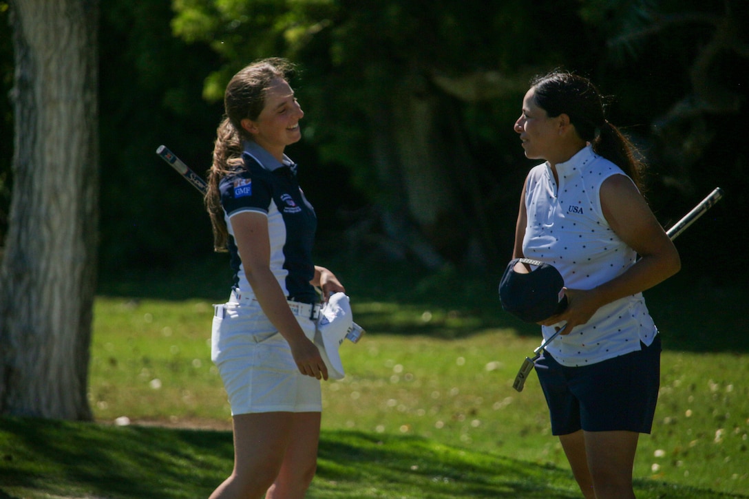 France's Pauline Stein (left) and USA's Melanie De Leon congratulate each other with Stein winning gold and De Leon winning silver during the 14th Edition of the Conseil International du Sport Militaire (CISM) World Military Golf Championship held at the Admiral Baker Golf Course in San Diego, Calif., hosted by Naval Base San Diego, Calif.  Nations from Bahrain, Canada, Denmark, Dominican Republic, Estonia, France, Germany, Ireland, Italy, Kazakhstan, Kenya, Latvia, Netherlands, Sri Lanka, Tanzania, Zimbabwe, and host USA compete for gold. Department of Defense Photo by Ms. Theresa Smith - Released.