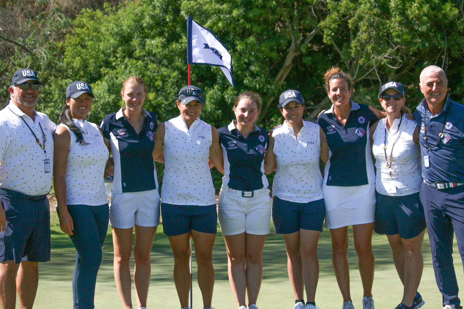 Team USA and France celebrate the end of the women's competition with USA winning gold and France capturing silver. 14th Edition of the Conseil International du Sport Militaire (CISM) World Military Golf Championship held at the Admiral Baker Golf Course in San Diego, Calif., hosted by Naval Base San Diego, Calif.  Nations from Bahrain, Canada, Denmark, Dominican Republic, Estonia, France, Germany, Ireland, Italy, Kazakhstan, Kenya, Latvia, Netherlands, Sri Lanka, Tanzania, Zimbabwe, and host USA compete for gold. Department of Defense Photo by Ms. Theresa Smith - Released.