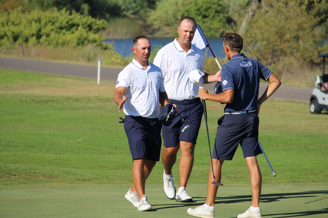 David Banks (left) from USA congratulates Nicolas Muller of France at the completion of the 14th Edition of the Conseil International du Sport Militaire (CISM) World Military Golf Championship held at the Admiral Baker Golf Course in San Diego, Calif., hosted by Naval Base San Diego, Calif.  Nations from Bahrain, Canada, Denmark, Dominican Republic, Estonia, France, Germany, Ireland, Italy, Kazakhstan, Kenya, Latvia, Netherlands, Sri Lanka, Tanzania, Zimbabwe, and host USA compete for gold. Department of Defense Photo by Ms. Theresa Smith - Released.