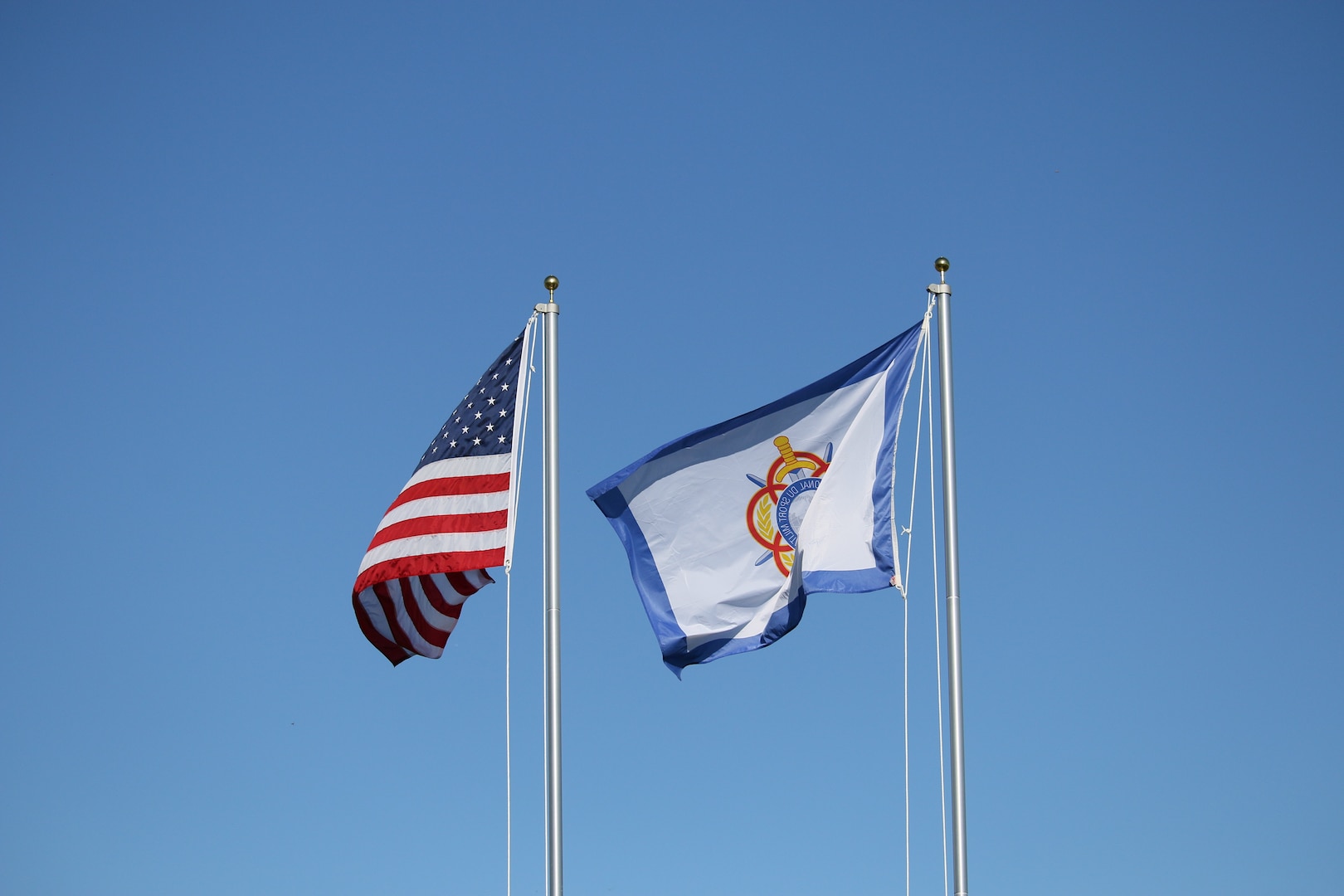 Flags fly during the 14th Edition of the Conseil International du Sport Militaire (CISM) World Military Golf Championship held at the Admiral Baker Golf Course in San Diego, Calif., hosted by Naval Base San Diego, Calif.  Nations from Bahrain, Canada, Denmark, Dominican Republic, Estonia, France, Germany, Ireland, Italy, Kazakhstan, Kenya, Latvia, Netherlands, Sri Lanka, Tanzania, Zimbabwe, and host USA compete for gold. Department of Defense Photo by Ms. Theresa Smith - Released.