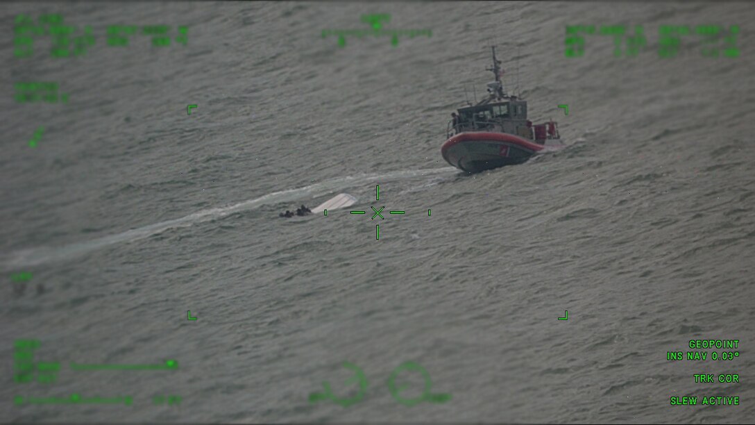 U.S. Coast Guard Station Pascagoula approaches an overturned boat near Horn Island, Mississippi on Oct. 7, 2023. Station would embark all eight people aboard their boat and safely get them to station and awaiting emergency medical personnel. (U.S. Coast Guard photo by Aviation Training Center Mobile)