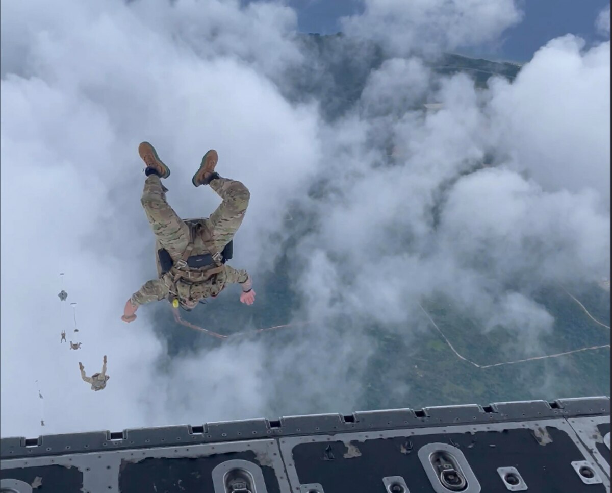 Members from the 320th Special Tactics Squadron jump from a C-130H Hercules.