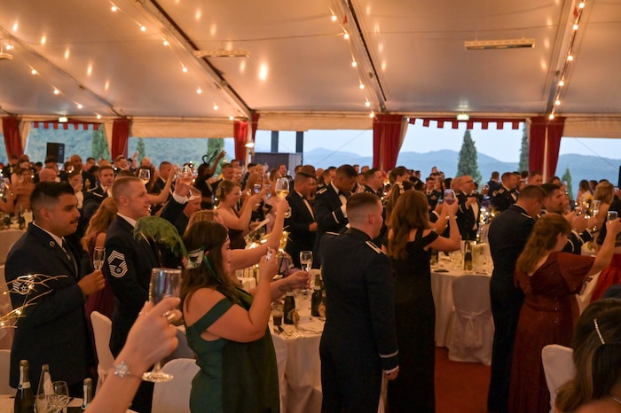 Members of the 31st Fighter Wing raise their glasses during the POW/MIA rememberance.
