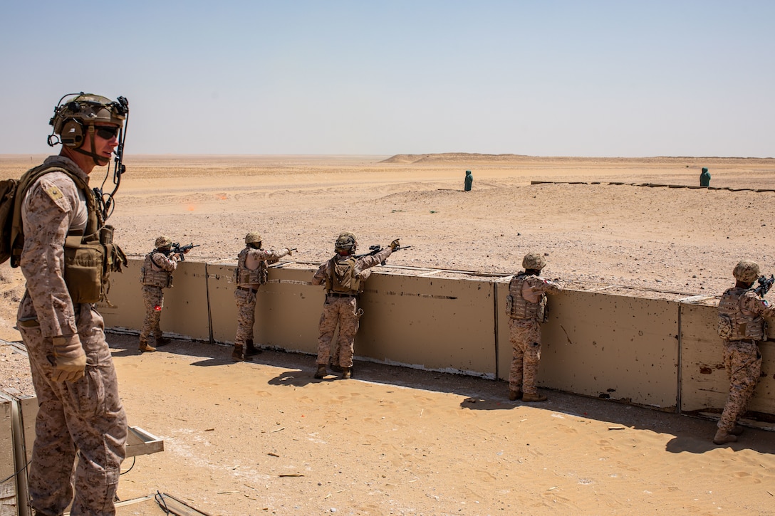 U.S. Marine Corps Maj. Travis Bird, Company Commander, Alpha Company, Battalion Landing Team 1/6, 26th Marine Expeditionary Unit (Special Operations Capable) (26MEU(SOC)), supervises the conduct of an integrated platoon reinforced live-fire range as Kuwaiti Marines provide supporting fire to U.S. Marines during a live-fire squad reinforced attack, Udairi Range Complex, Kuwait, Sept. 6, 2023. Elements of the 26th MEU(SOC) conducted bilateral training with Kuwait armed forces to increase interoperability, maintain operational readiness, and strengthen relationships with partner forces. Components of the Bataan Amphibious Ready Group and 26th MEU(SOC) are deployed to the U.S. 5th Fleet area of operations to help ensure maritime security and stability in the Middle East region. (U.S. Marine Corps photo by Gunnery Sgt. Jeffrey Cordero)