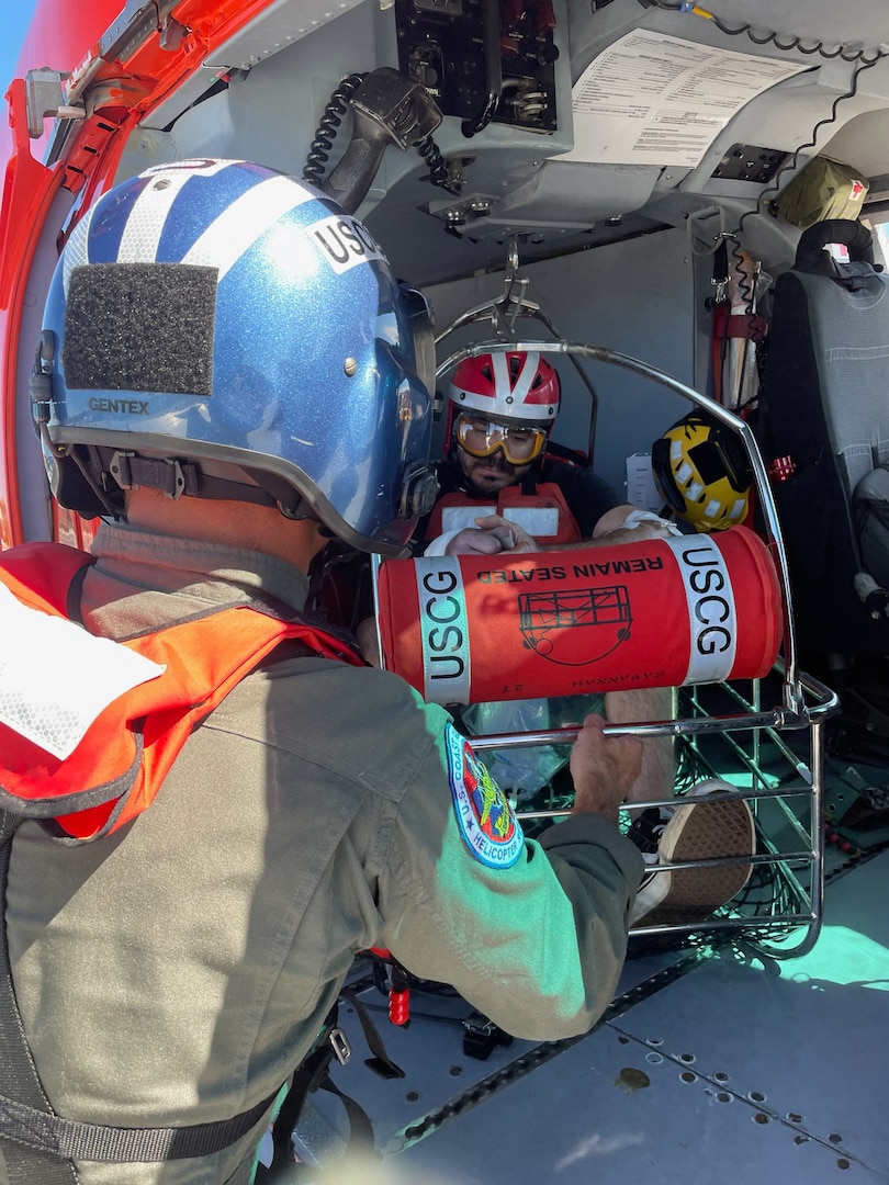A Coast Guard Air Station Savannah helicopter crew medevacs a 43-year-old crew member from the Thomas Jefferson, a 208-foot survey vessel, 51 miles offshore Charleston, South Carolina, Oct. 8, 2023.