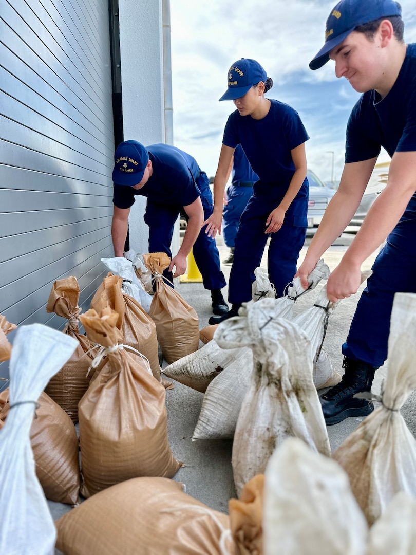 Crews from U.S. Coast Guard Forces Micronesia/Sector Guam place sandbags at the unit in Guam ahead of Tropical Storm Bolaven on Oct. 9, 2023. Tropical Storm Bolaven strengthened after passing through the Federated States of Micronesia and is forecast to intensify through Tuesday afternoon, possibly becoming a typhoon. (U.S. Coast Guard photo by Chief Warrant Officer Sara Muir)