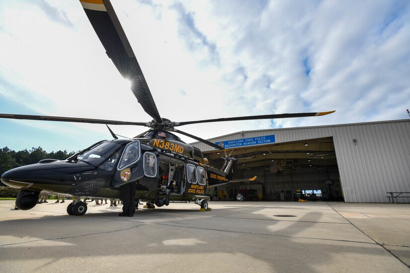 Helicopter sits on the flight line.