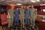 AT SEA (Oct. 8, 2023) Japan Maritime Self-Defense Force (JMSDF) Vice Adm. Akira Saito, left, Commander in Chief, Self Defense Fleet, JMSDF, Vice Adm. Karl Thomas, center, Commander, U.S. 7th Fleet, and Republic of Korea Navy (ROK-N) Vice Adm. Myung-soo Kim, Commander, ROK-N Fleet pose for a photo alongside leadership from Commander, Task Force 70 (CTF 70).