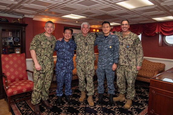 AT SEA (Oct. 8, 2023) Japan Maritime Self-Defense Force (JMSDF) Vice Adm. Akira Saito, left, Commander in Chief, Self Defense Fleet, JMSDF, Vice Adm. Karl Thomas, center, Commander, U.S. 7th Fleet, and Republic of Korea Navy (ROK-N) Vice Adm. Myung-soo Kim, Commander, ROK-N Fleet pose for a photo alongside leadership from Commander, Task Force 70 (CTF 70).