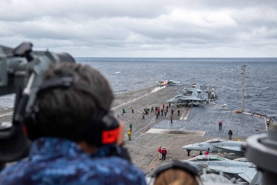 231008-N-OE145-1145 AT SEA (Oct. 8, 2023) A member of Japan Maritime Self-Defense Force (JMSDF), observes flight operations from vultures row aboard the U.S. Navy’s only forward-deployed aircraft carrier, USS Ronald Reagan (CVN 76), during a tri-lateral summit, Oct. 8. The embarkation included a tour of Ronald Reagan and facilitated talks between flag officers representing U.S., JMSDF, and Republic of Korea Navy (ROK-N) forces. Ronald Reagan, the flagship of Carrier Strike Group 5, provides a combat-ready force that protects and defends the United States, and supports alliances, partnerships and collective maritime interests in the Indo-Pacific region. (U.S. Navy photo by Mass Communication Specialist 3rd Class Jordan Brown)