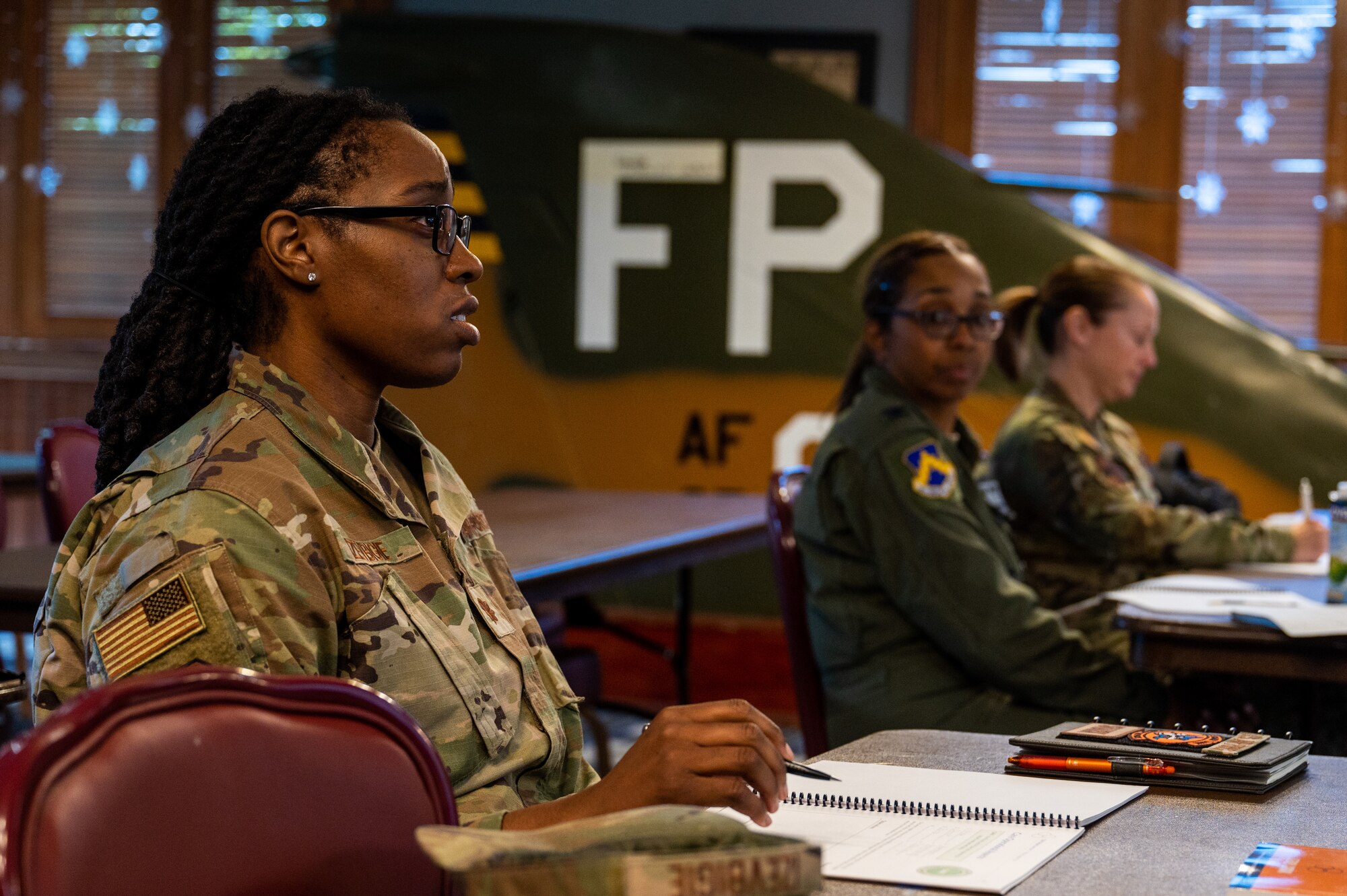 Maj. Osasumwen Izevbigie answers a question during the Lead, Develop, Care educational course.