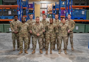 A photo of several Airmen standing in a small formation.